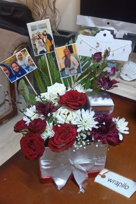 Birthday gift with flowers and photos